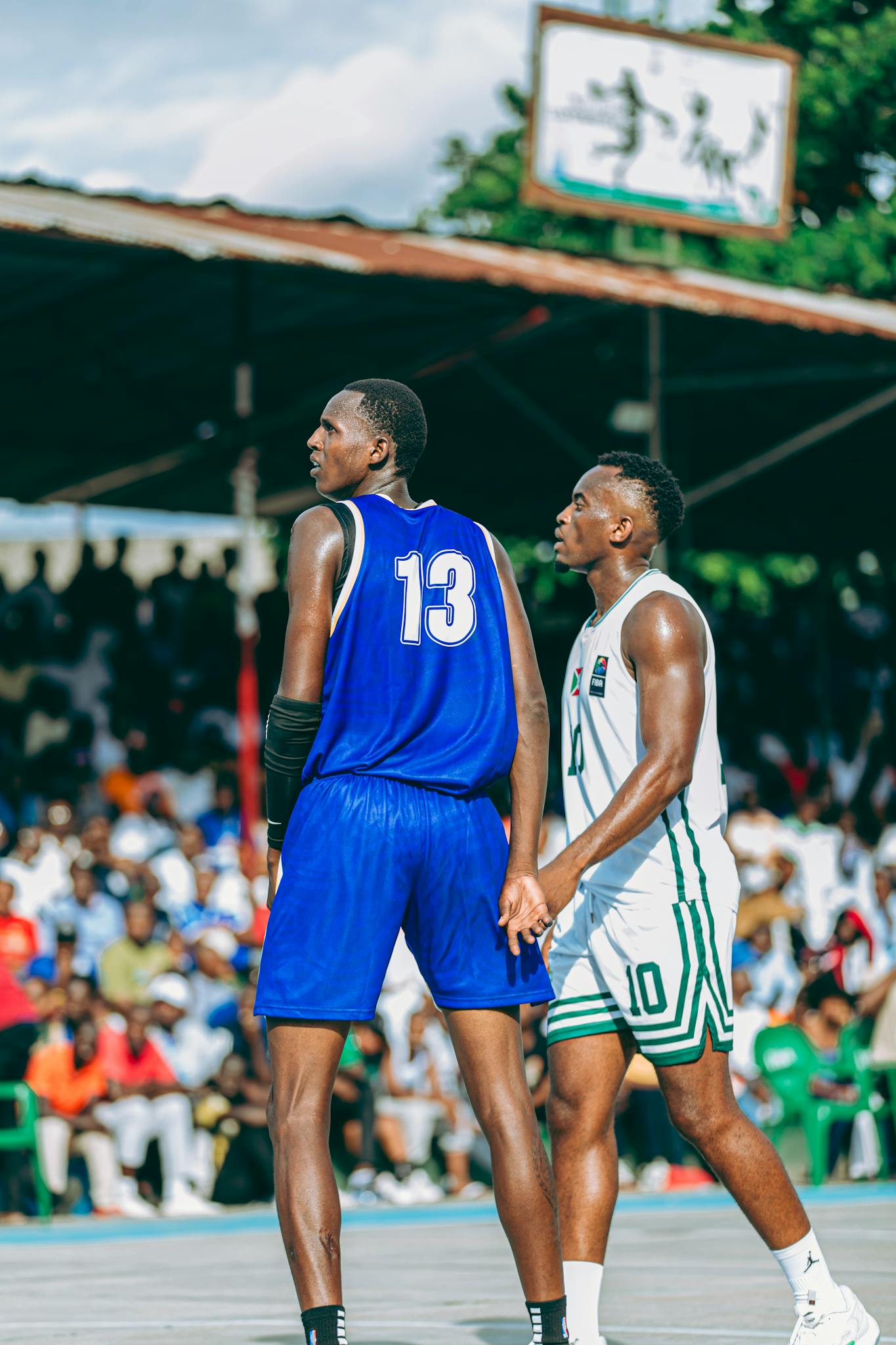 Players in action during a vibrant outdoor basketball game.